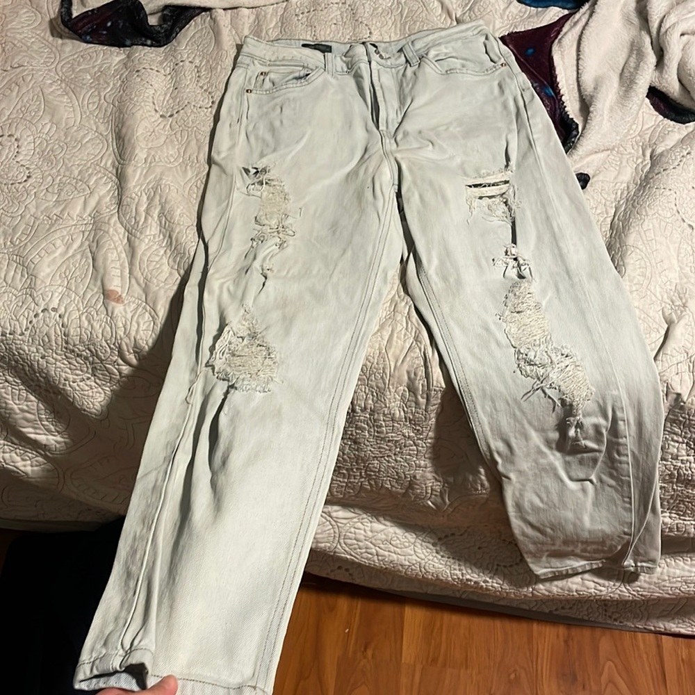 Light blue washed out ripped denim jeans